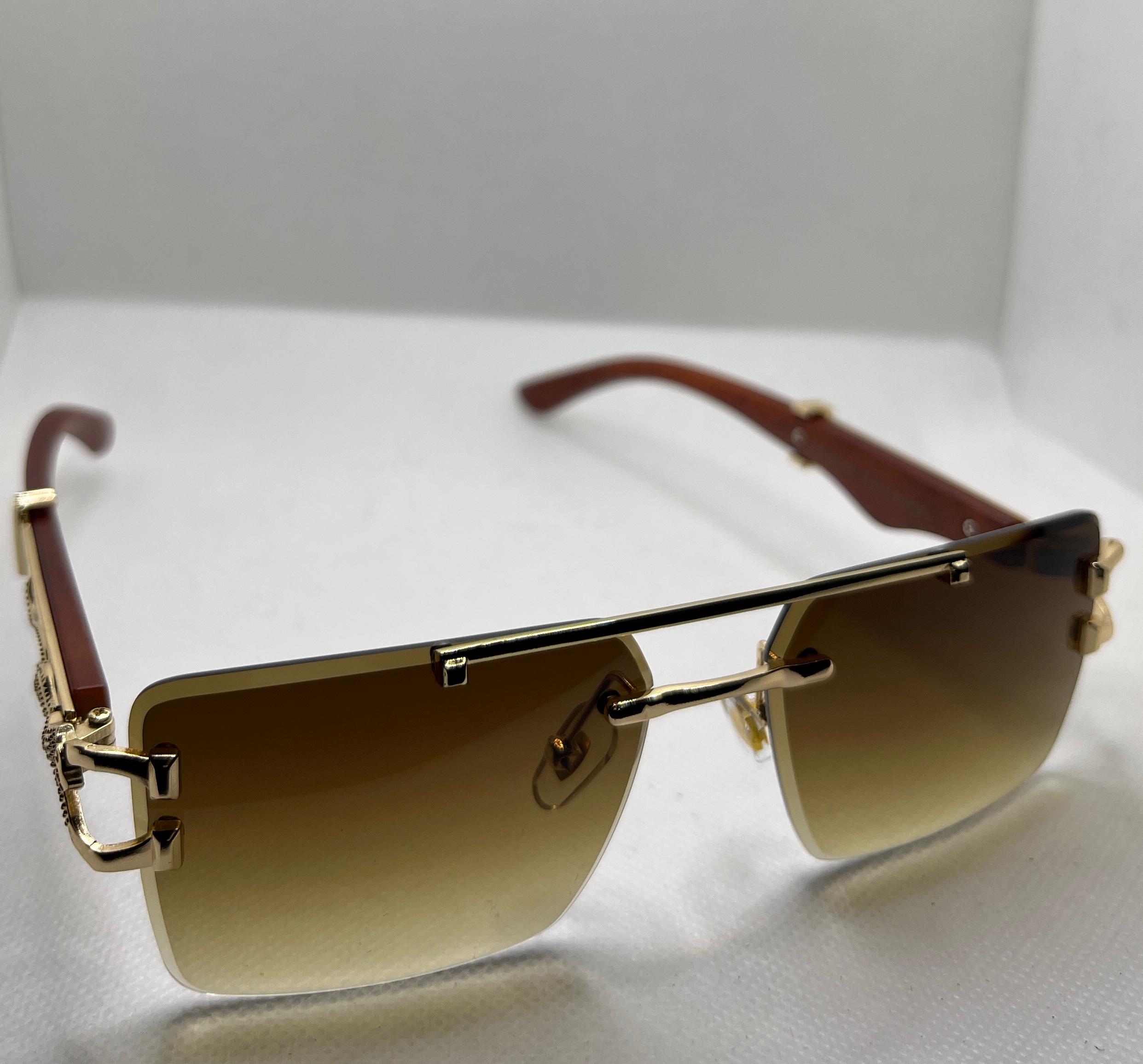  Meeran jaguar sunglasses with blue lenses and a black/gold frame, featuring UV protection
